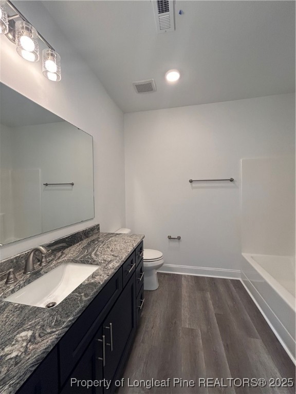 407 Morehead Street Spring Lake, NC 28390 - Photo 9 of 12 a bathroom with a granite countertop sink and a mirror