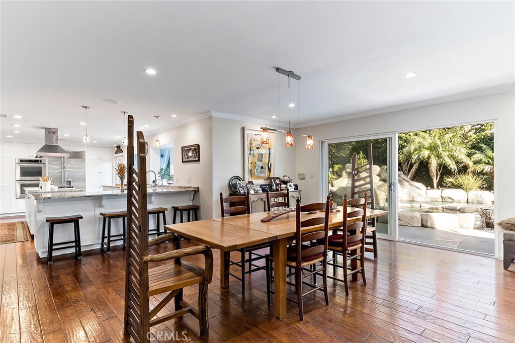 11792 Silver Fox Road Rossmoor, CA 90720 - Photo 15 of 49 a view of a dining room with furniture window and wooden floor