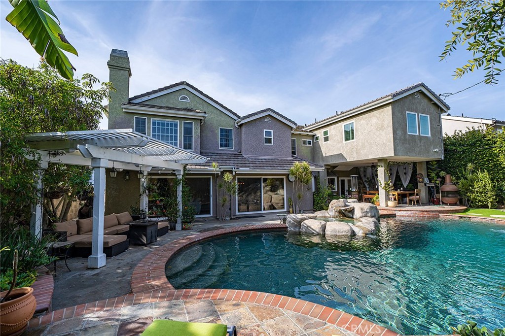 11792 Silver Fox Road Rossmoor, CA 90720 - Photo 17 of 49 a front view of a house with garden