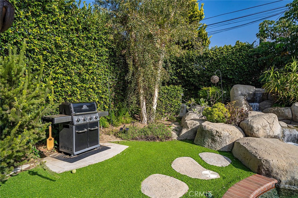 11792 Silver Fox Road Rossmoor, CA 90720 - Photo 22 of 49 a view of a backyard with furniture