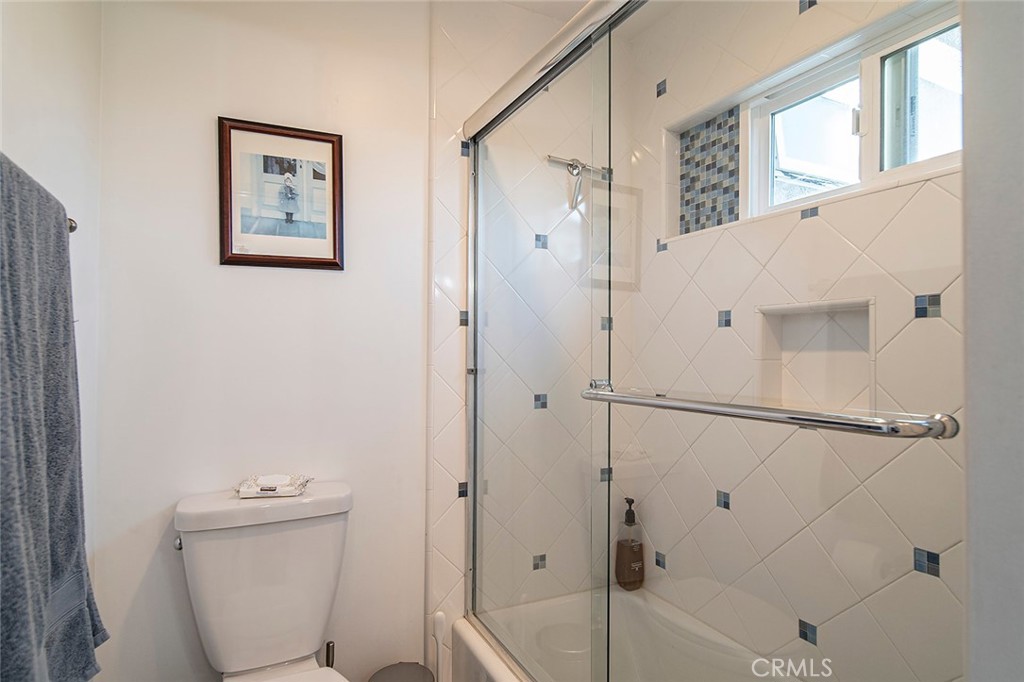 11792 Silver Fox Road Rossmoor, CA 90720 - Photo 25 of 49 a bathroom with a shower and a toilet