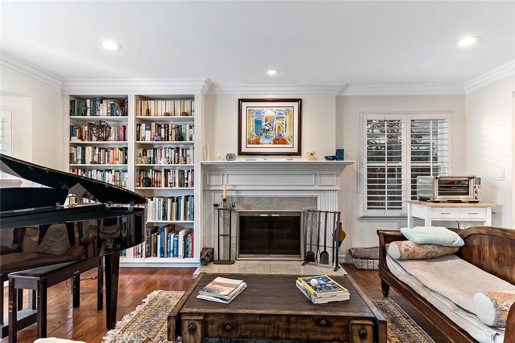 11792 Silver Fox Road Rossmoor, CA 90720 - Photo 2 of 49 a living room with furniture and a fireplace