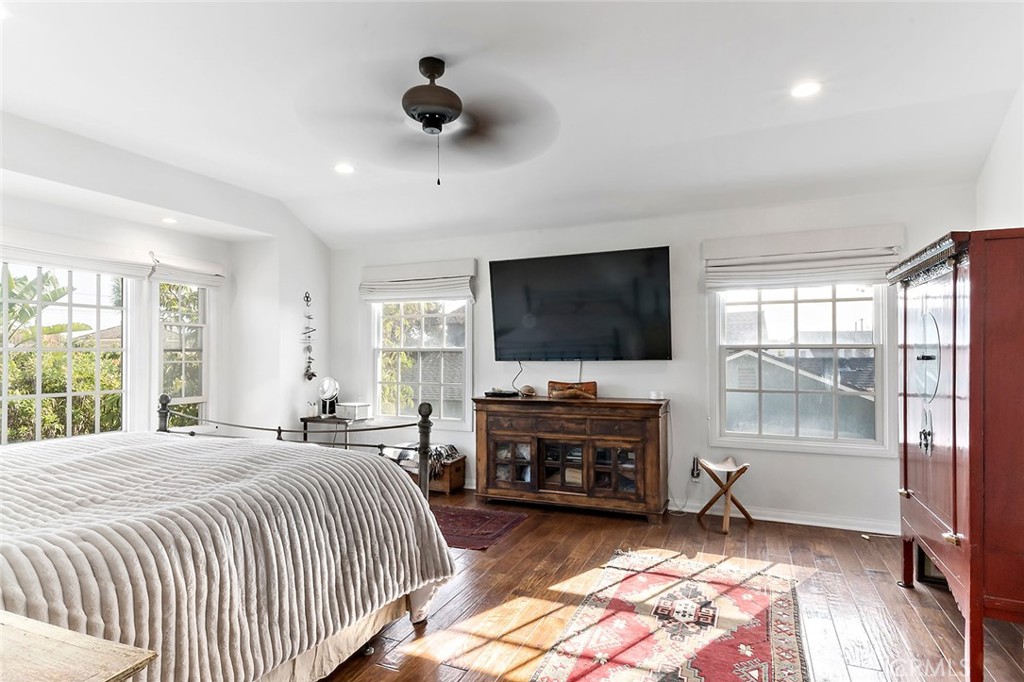 11792 Silver Fox Road Rossmoor, CA 90720 - Photo 31 of 49 a bedroom with a bed and a flat screen tv