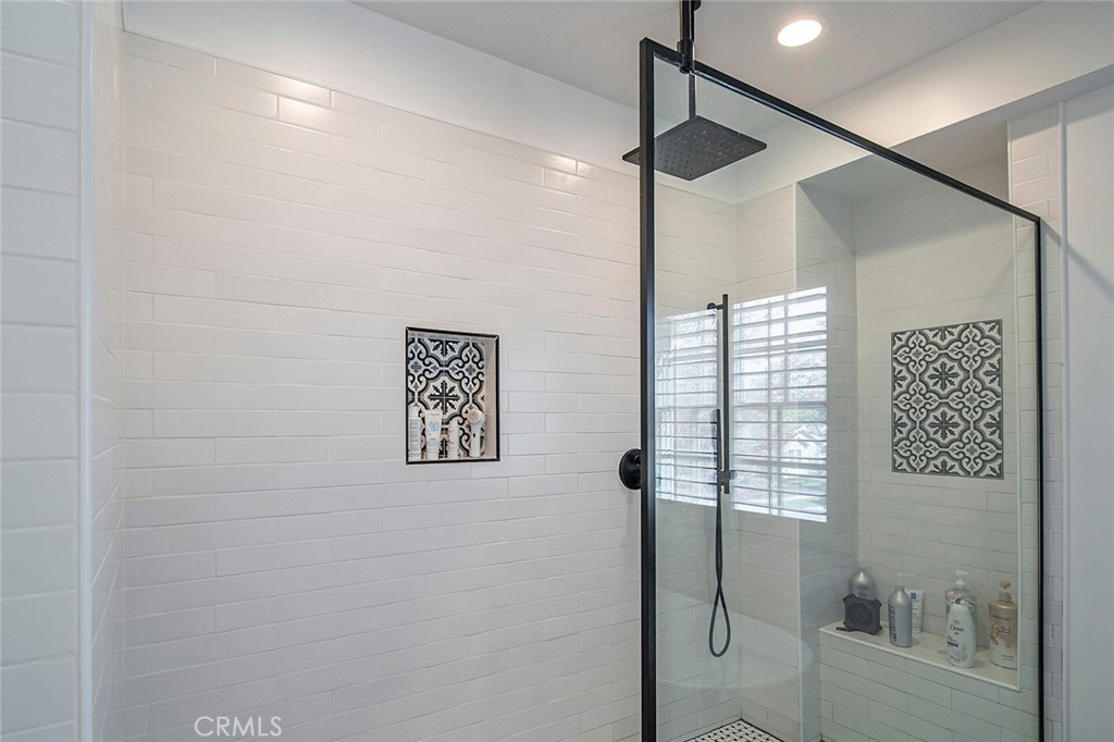 11792 Silver Fox Road Rossmoor, CA 90720 - Photo 35 of 49 a bathroom with a shower and a window