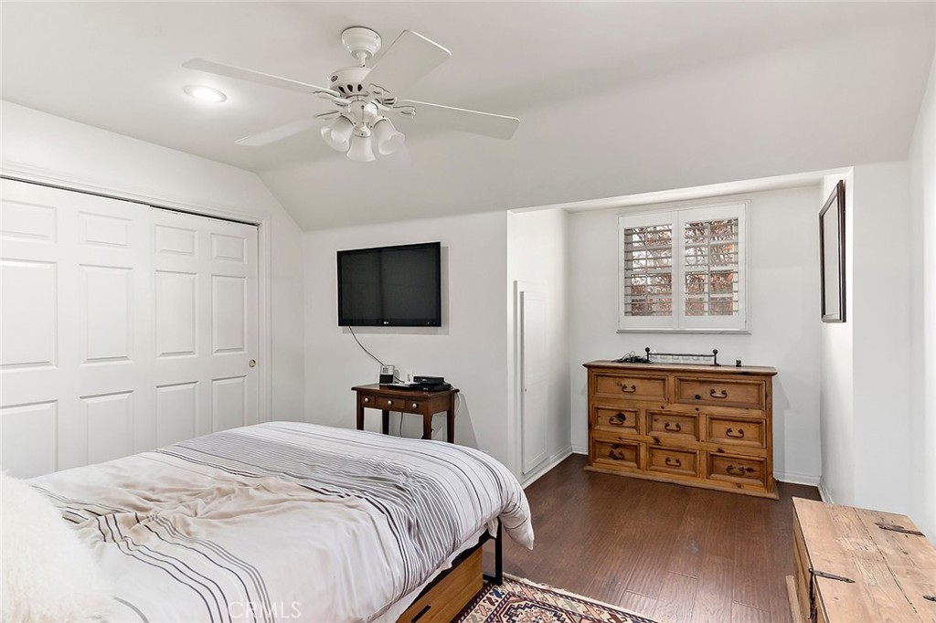 11792 Silver Fox Road Rossmoor, CA 90720 - Photo 37 of 49 a bedroom with a bed and a flat screen tv