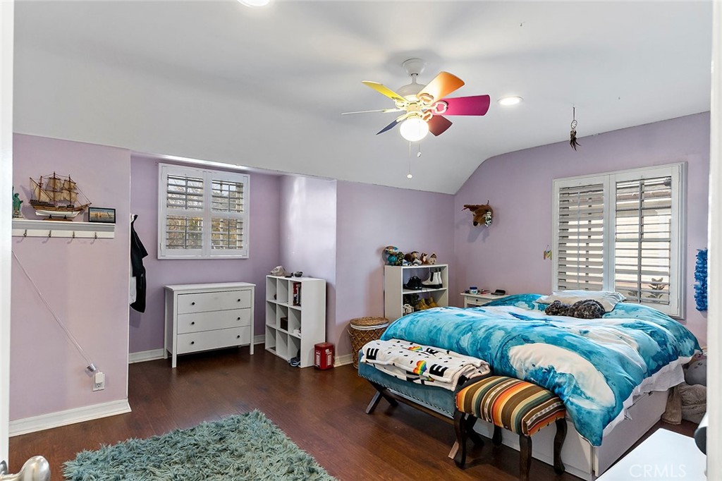 11792 Silver Fox Road Rossmoor, CA 90720 - Photo 42 of 49 a bedroom with furniture and a window