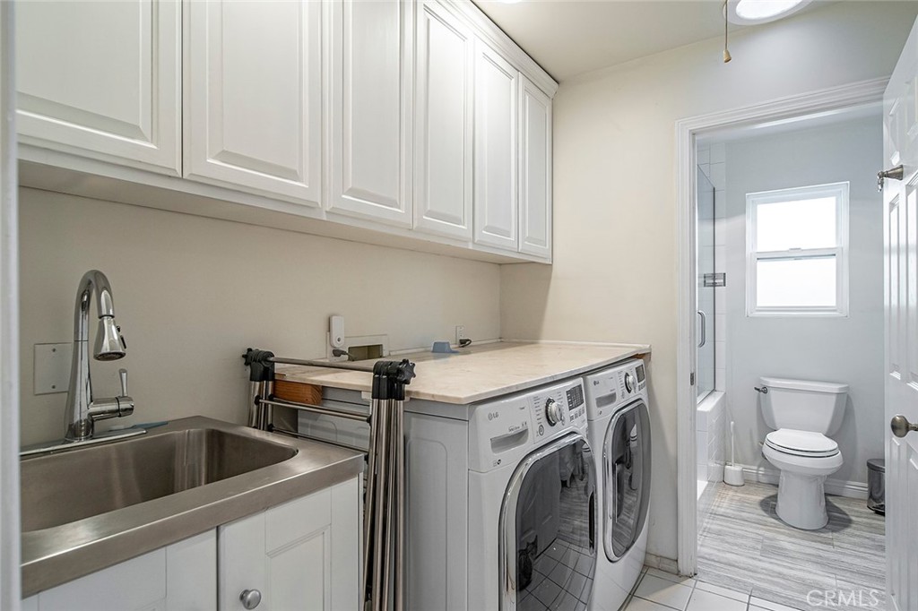 11792 Silver Fox Road Rossmoor, CA 90720 - Photo 43 of 49 a view of a kitchen with sink and washer