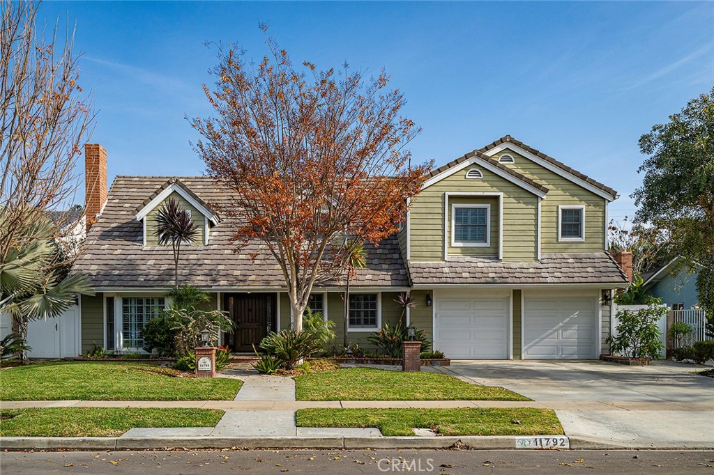 11792 Silver Fox Road Rossmoor, CA 90720 - Photo 48 of 49 a front view of a house with a yard