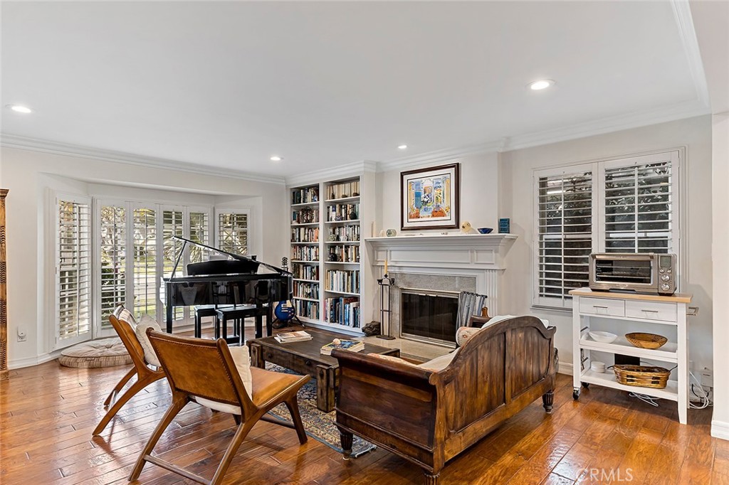 11792 Silver Fox Road Rossmoor, CA 90720 - Photo 4 of 49 a living room with furniture and a fireplace