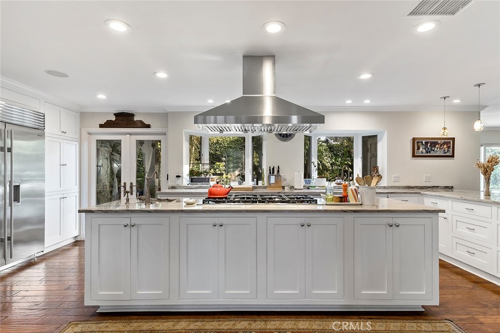 11792 Silver Fox Road Rossmoor, CA 90720 - Photo 7 of 49 a kitchen with sink and cabinets