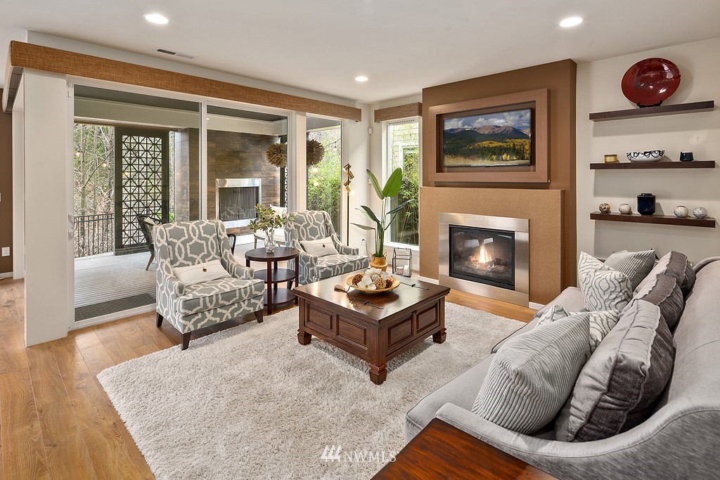 3901 171st Street Southeast Bothell, WA 98012 - Photo 10 of 40 a living room with furniture and a fireplace