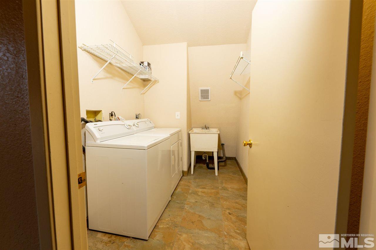 115 Silverstone Place Reno, NV 89512 - Photo 14 of 32 a utility room with dryer and washer