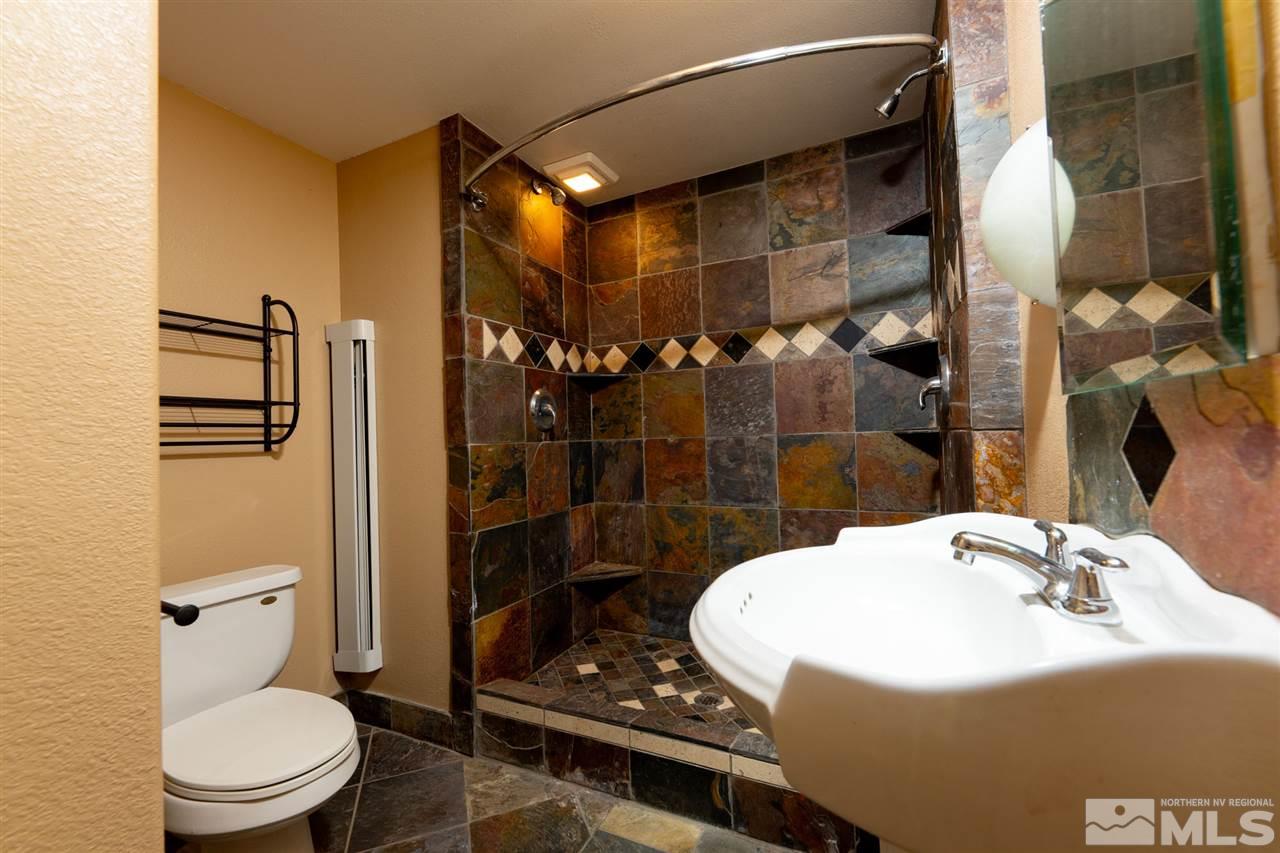 115 Silverstone Place Reno, NV 89512 - Photo 23 of 32 a bathroom with a sink toilet and shower