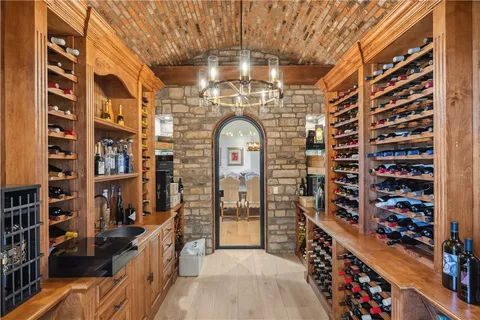 walk in closet with wooden floor