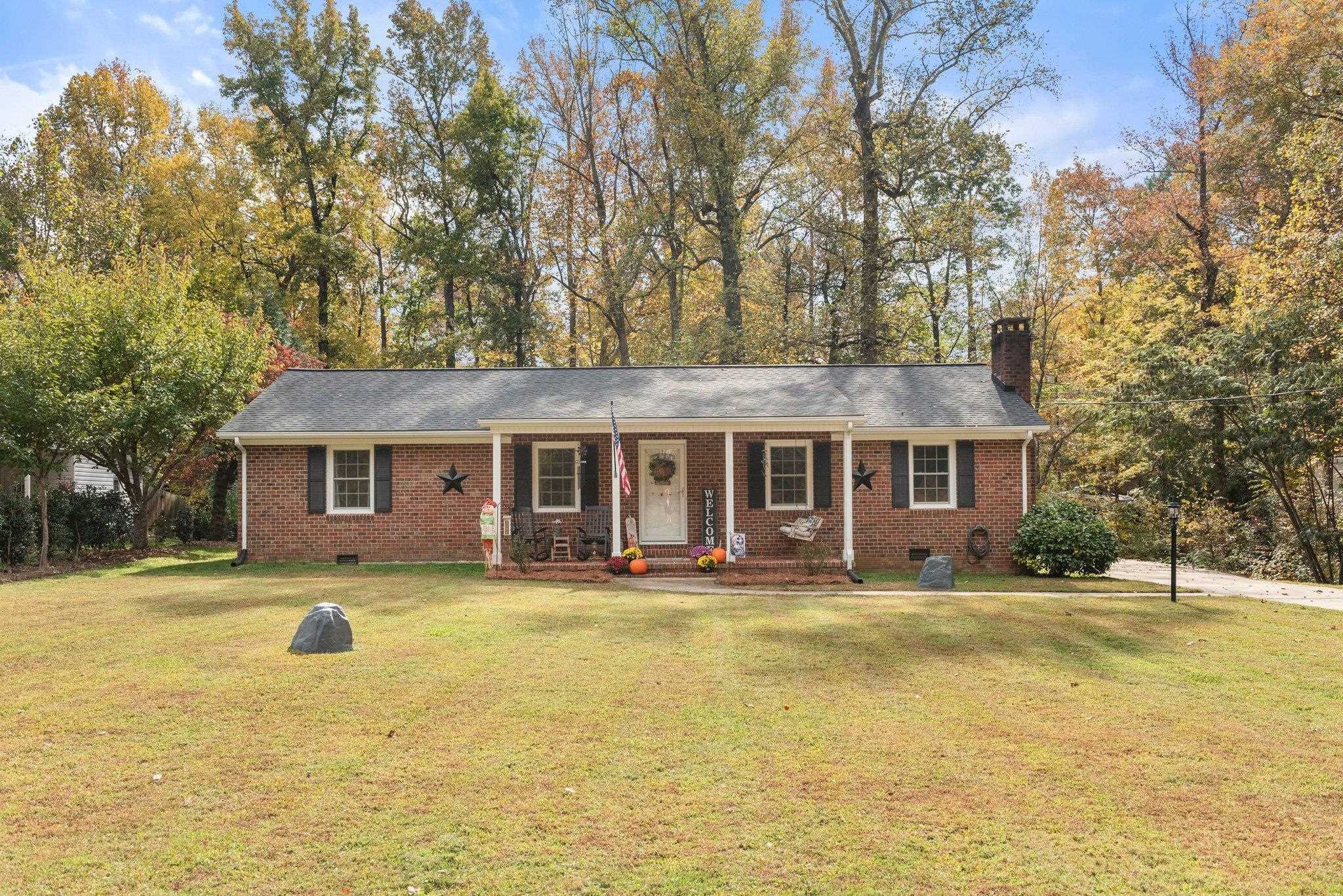 1818 Wellington Road Burlington, NC 27217 - Photo 1 of 36 a view of a house with swimming pool and a yard