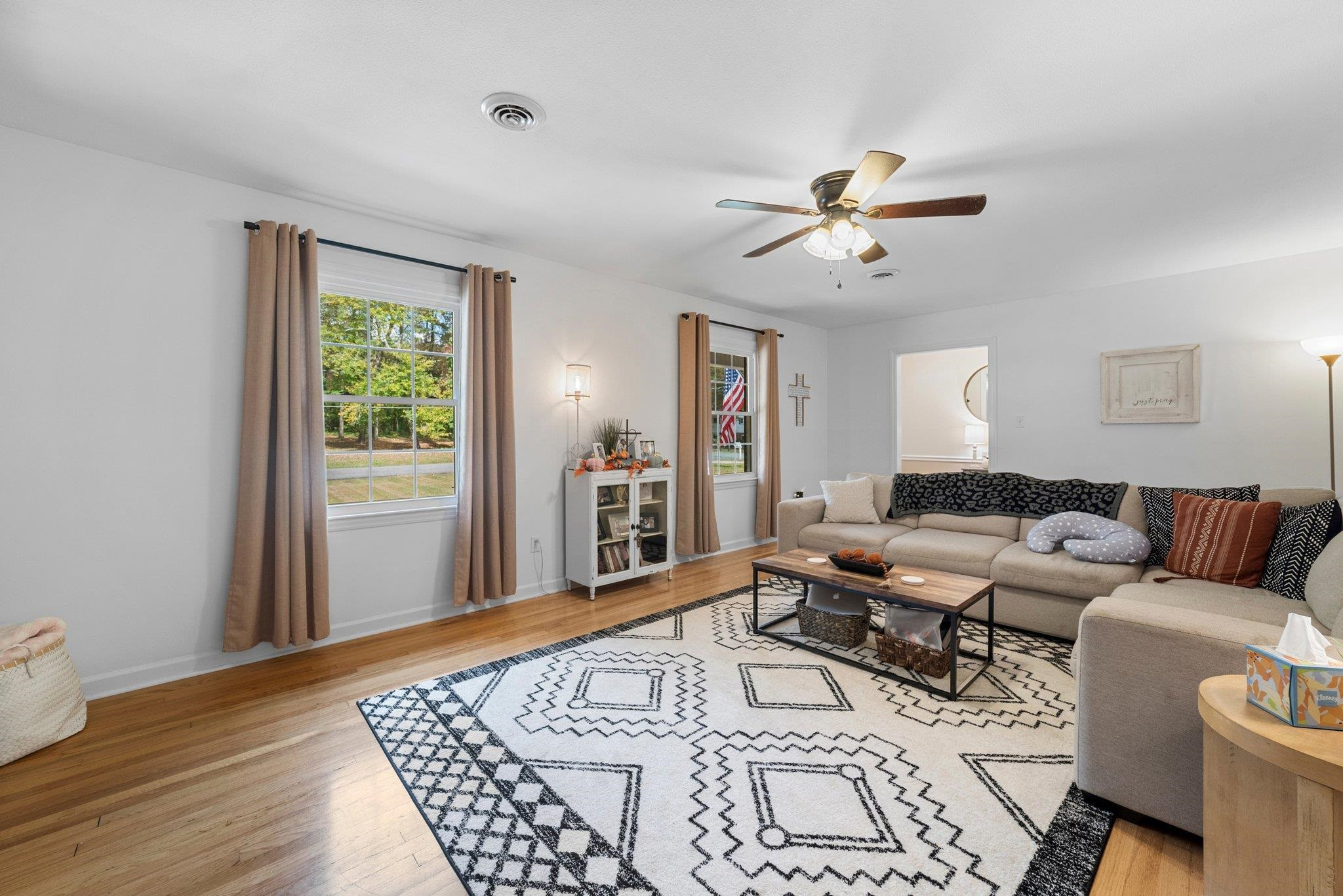 1818 Wellington Road Burlington, NC 27217 - Photo 11 of 36 a living room with furniture and a rug