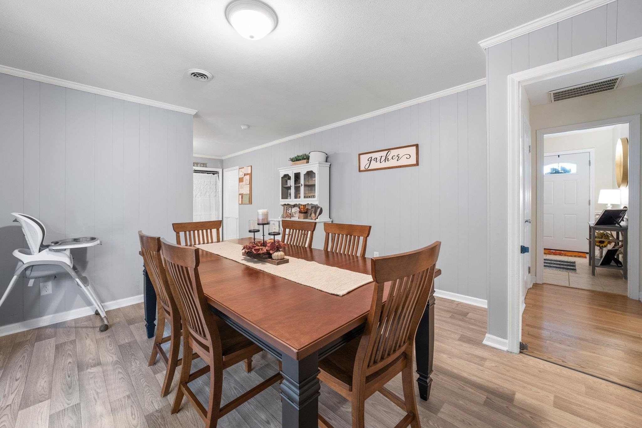 1818 Wellington Road Burlington, NC 27217 - Photo 14 of 36 a view of a dining room with furniture and wooden floor