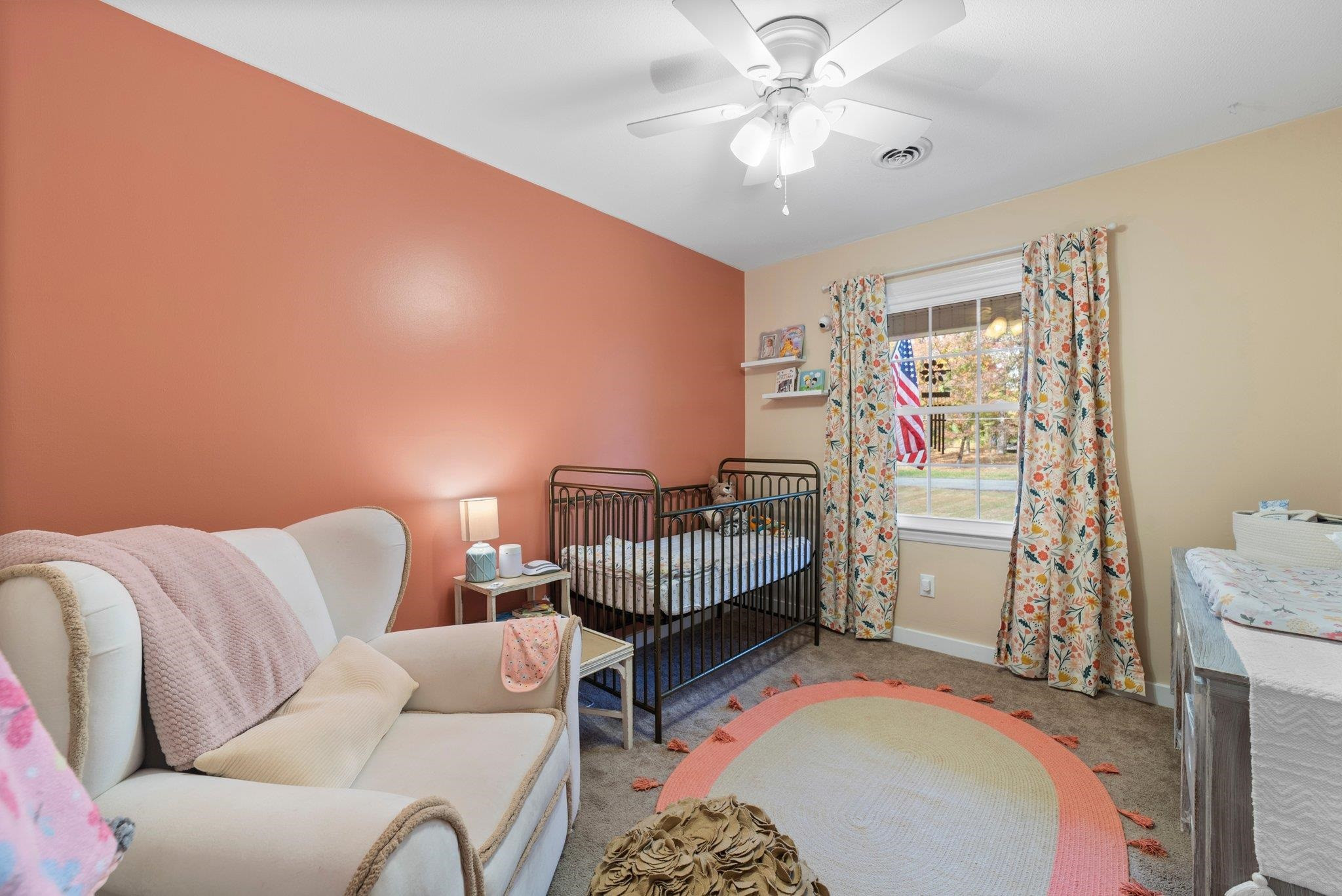 1818 Wellington Road Burlington, NC 27217 - Photo 20 of 36 a living room with furniture and a chandelier