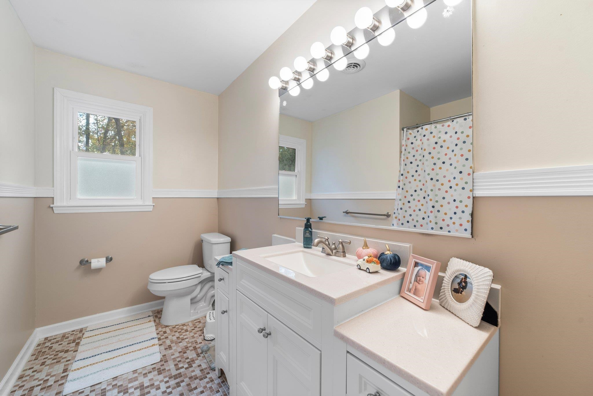 1818 Wellington Road Burlington, NC 27217 - Photo 22 of 36 a bathroom with a sink toilet and vanity