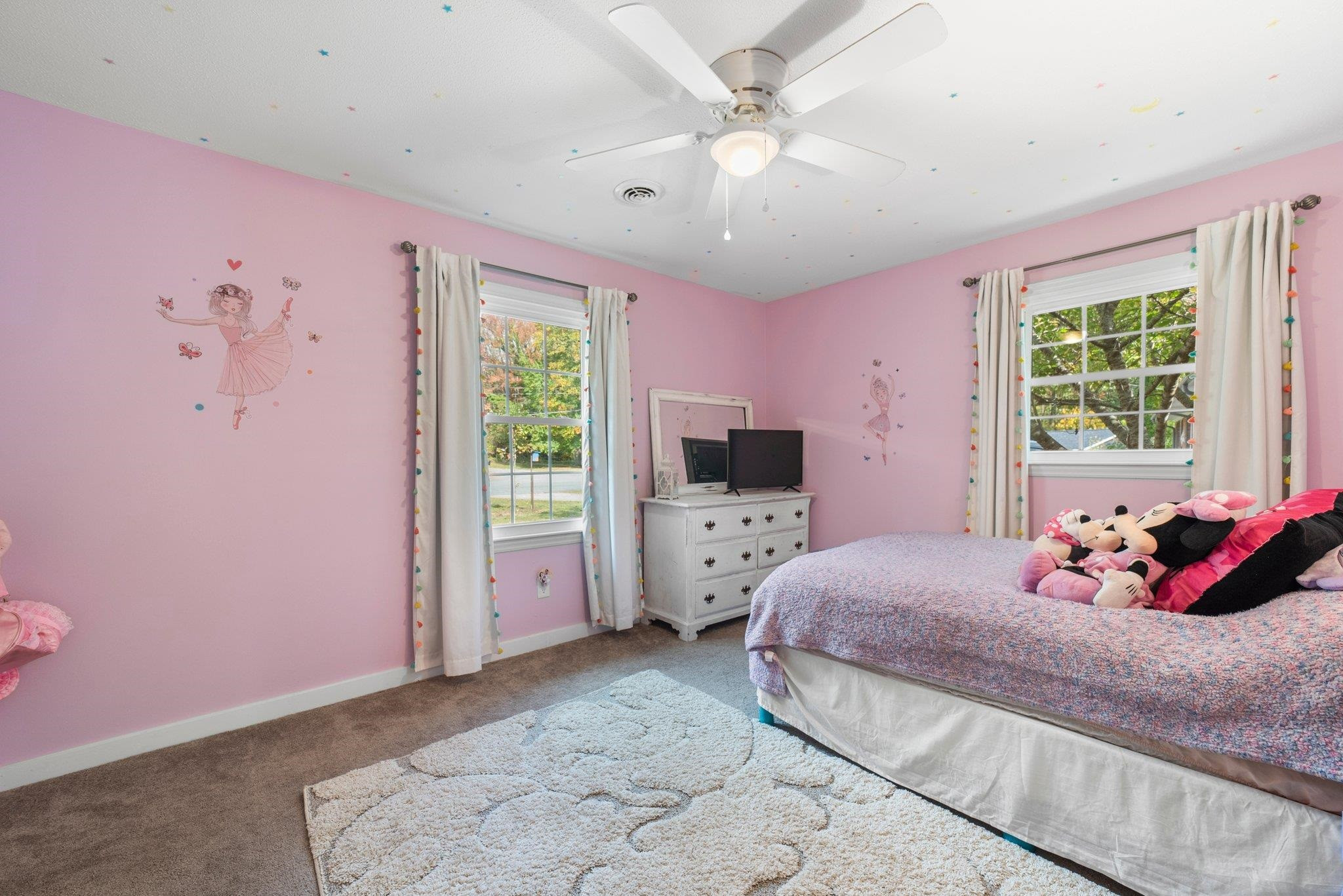 1818 Wellington Road Burlington, NC 27217 - Photo 24 of 36 a bedroom with a bed and a flat screen tv
