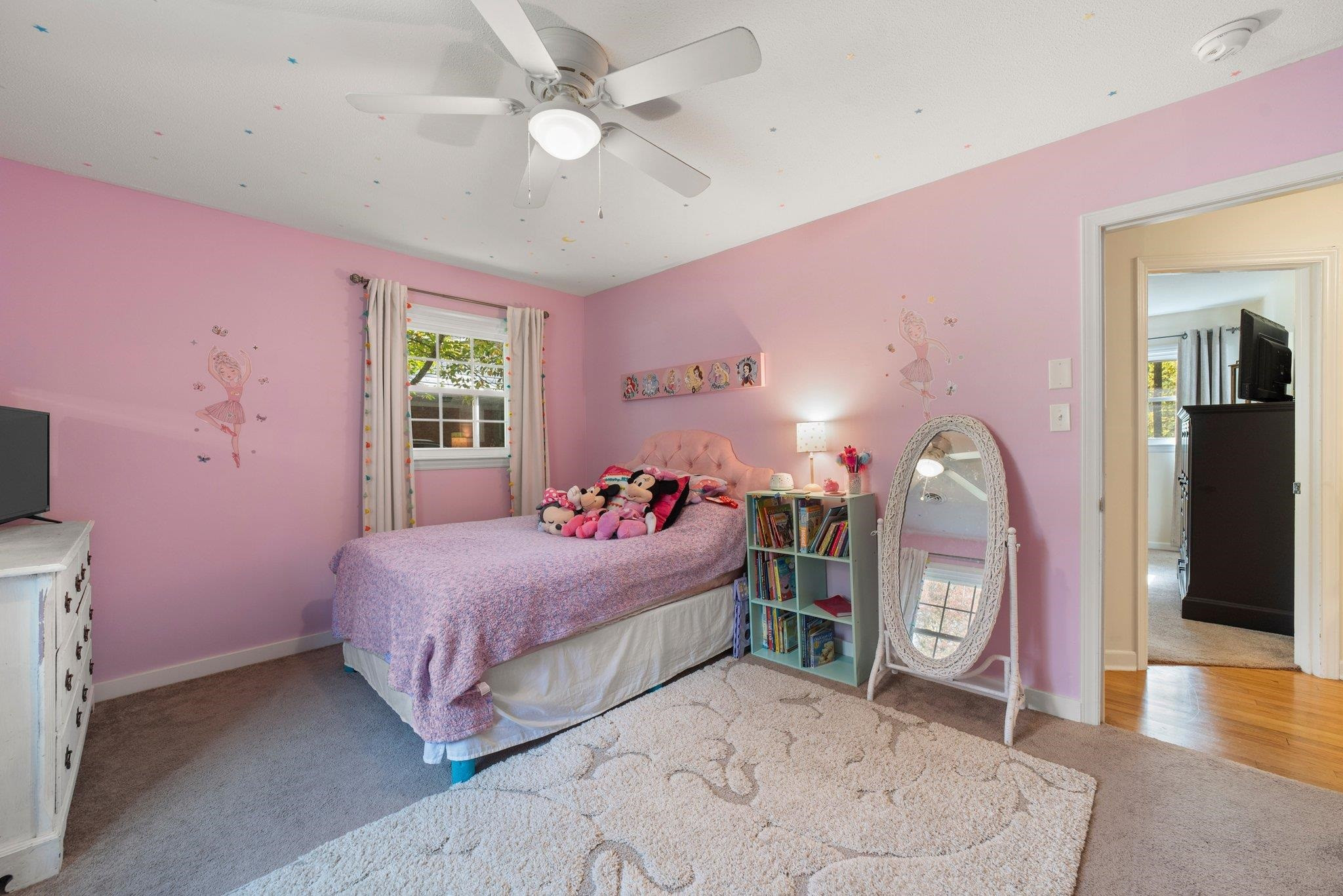 1818 Wellington Road Burlington, NC 27217 - Photo 25 of 36 a bedroom with a bed and a chandelier
