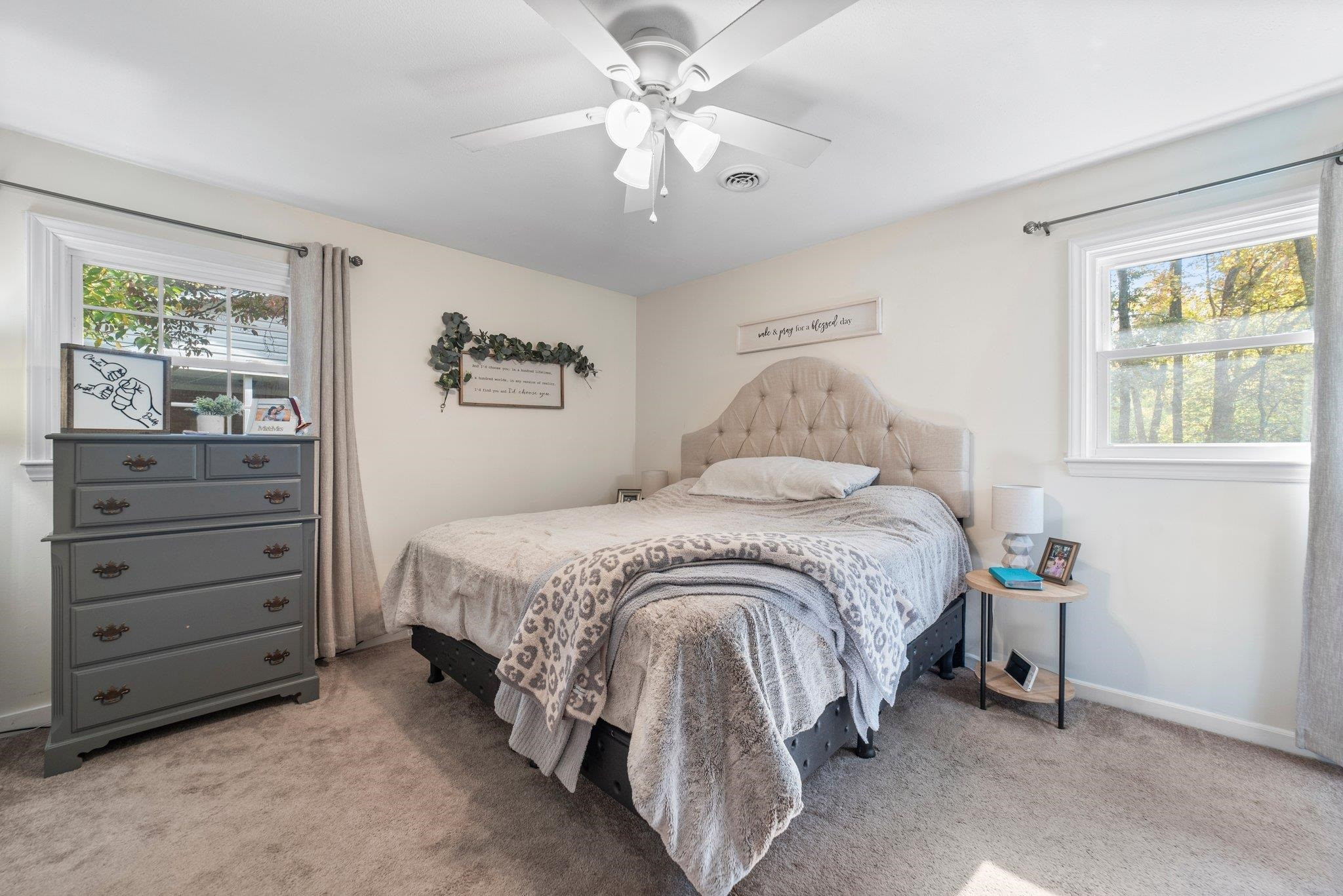 1818 Wellington Road Burlington, NC 27217 - Photo 26 of 36 a spacious bedroom with a bed and a cabinets