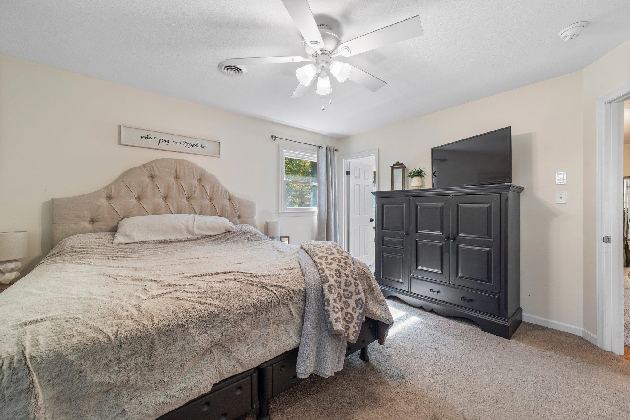 1818 Wellington Road Burlington, NC 27217 - Photo 27 of 36 a bedroom with a bed and a television