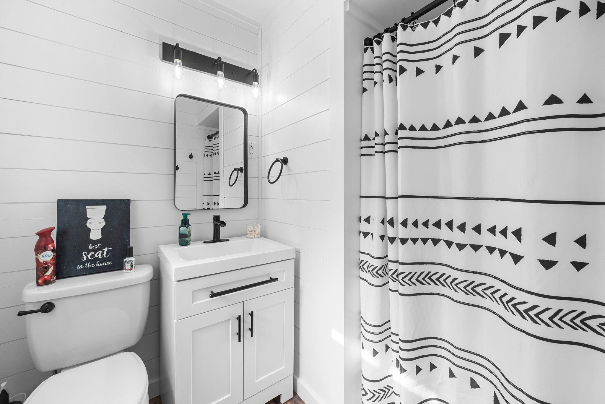 1818 Wellington Road Burlington, NC 27217 - Photo 29 of 36 a bathroom with a sink a toilet and a mirror