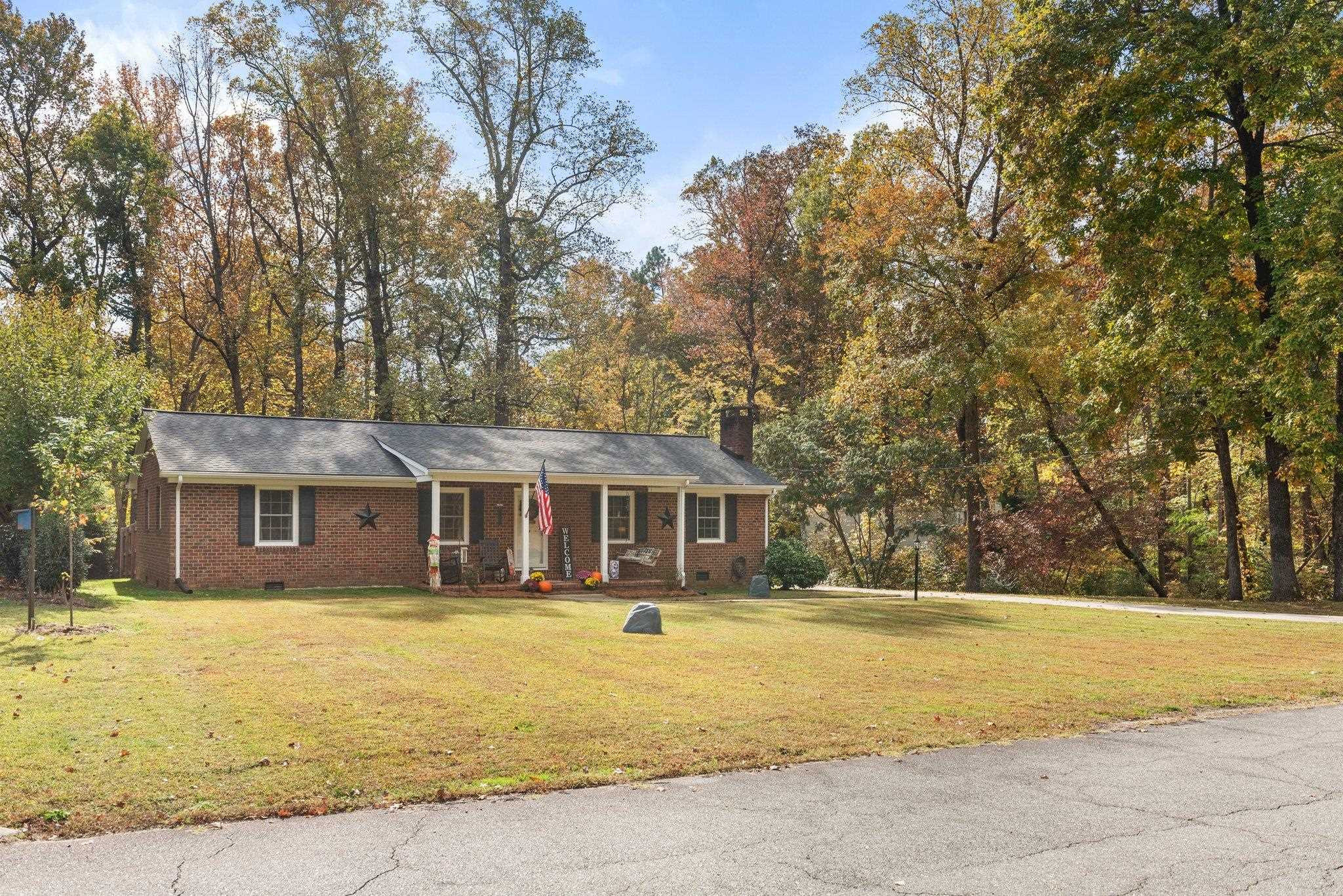 1818 Wellington Road Burlington, NC 27217 - Photo 32 of 36 a front view of a house with a yard