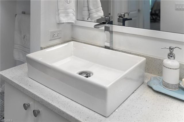 a white bath tub sitting in a bathroom