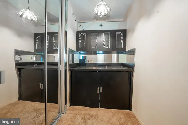 a kitchen with a sink and refrigerator