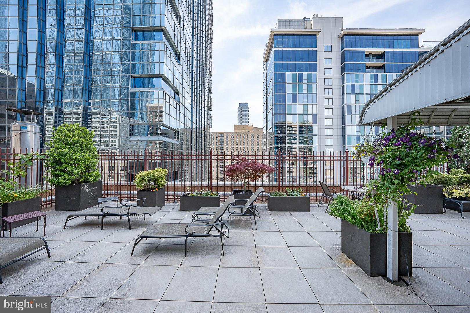 1900 John F Kennedy Boulevard, Unit 1012 Philadelphia, PA 19103 - Photo 21 of 22 a view of a patio with couches and potted plants