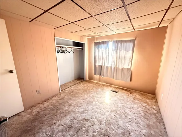 a view of a room with a wooden door