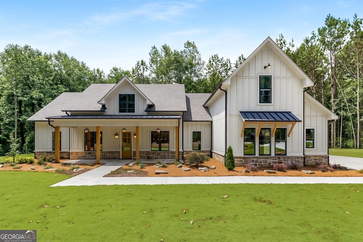 229 Eagles Way Eatonton, GA 31024 - Photo 1 of 61 a front view of house with yard and green space