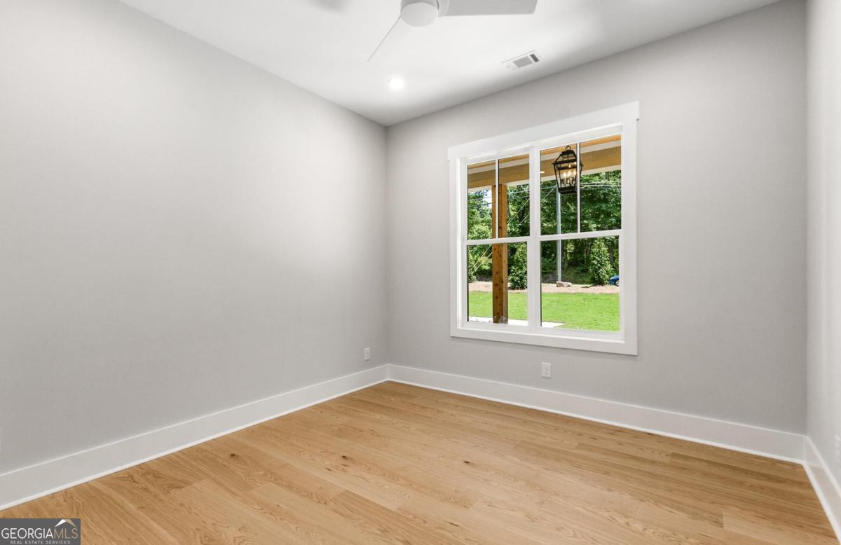 229 Eagles Way Eatonton, GA 31024 - Photo 19 of 61 an empty room with a window