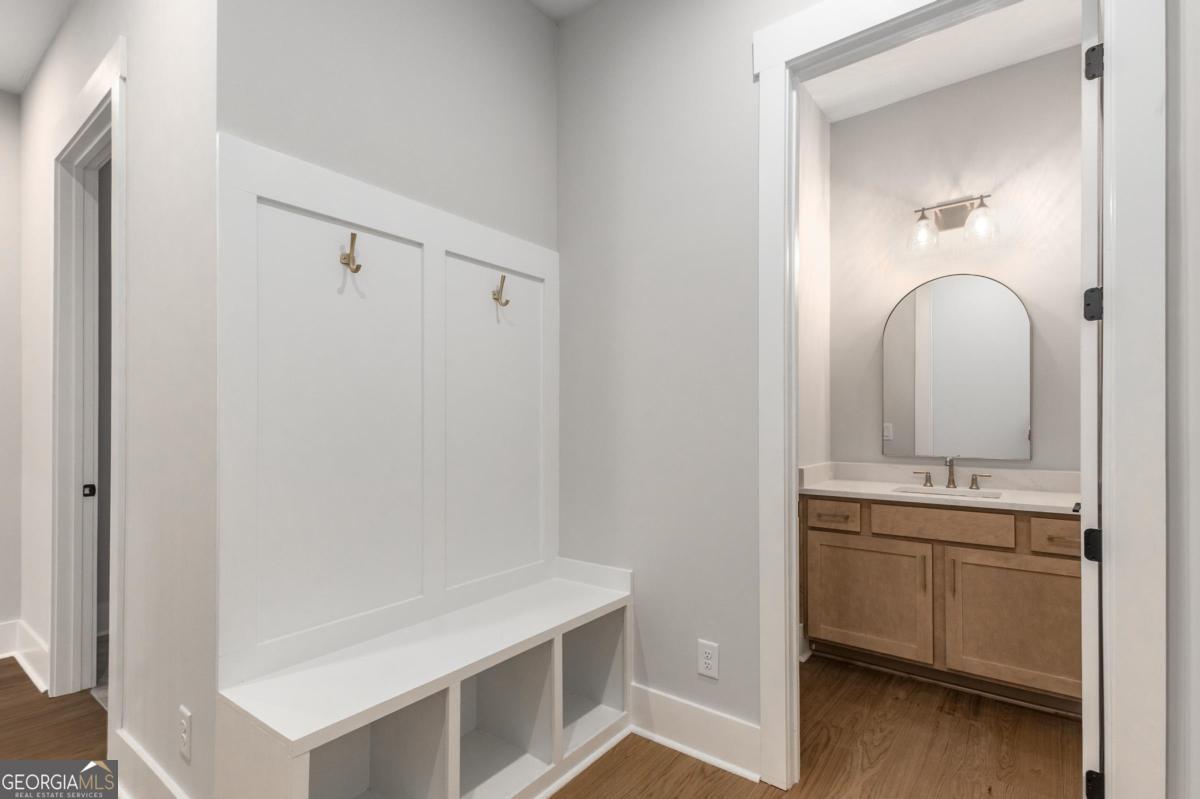 229 Eagles Way Eatonton, GA 31024 - Photo 25 of 61 a bathroom with a sink and a mirror