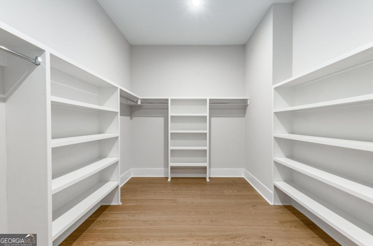 229 Eagles Way Eatonton, GA 31024 - Photo 29 of 61 a view of walk in closet with empty racks