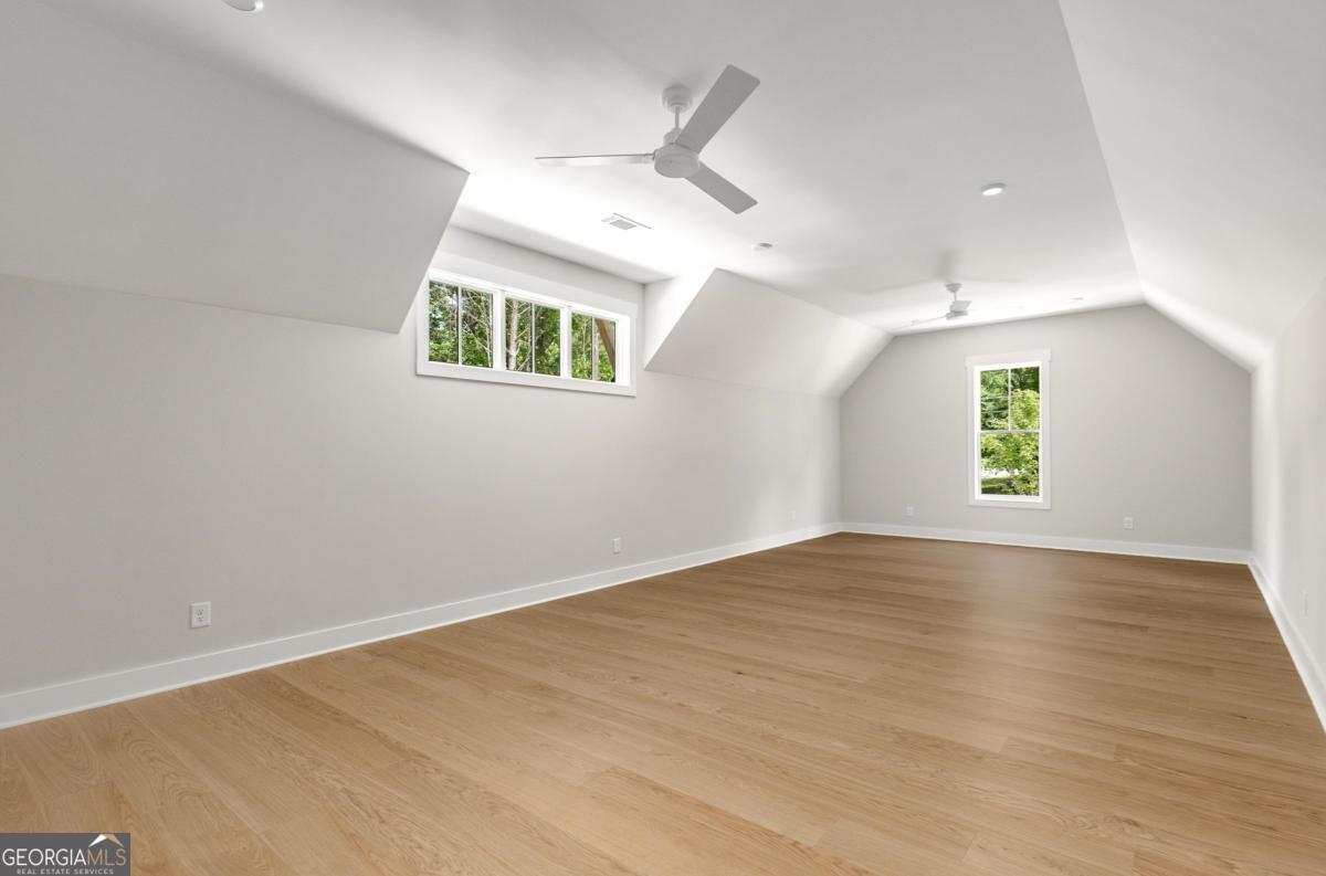 229 Eagles Way Eatonton, GA 31024 - Photo 32 of 61 an empty room with window and ceiling fan