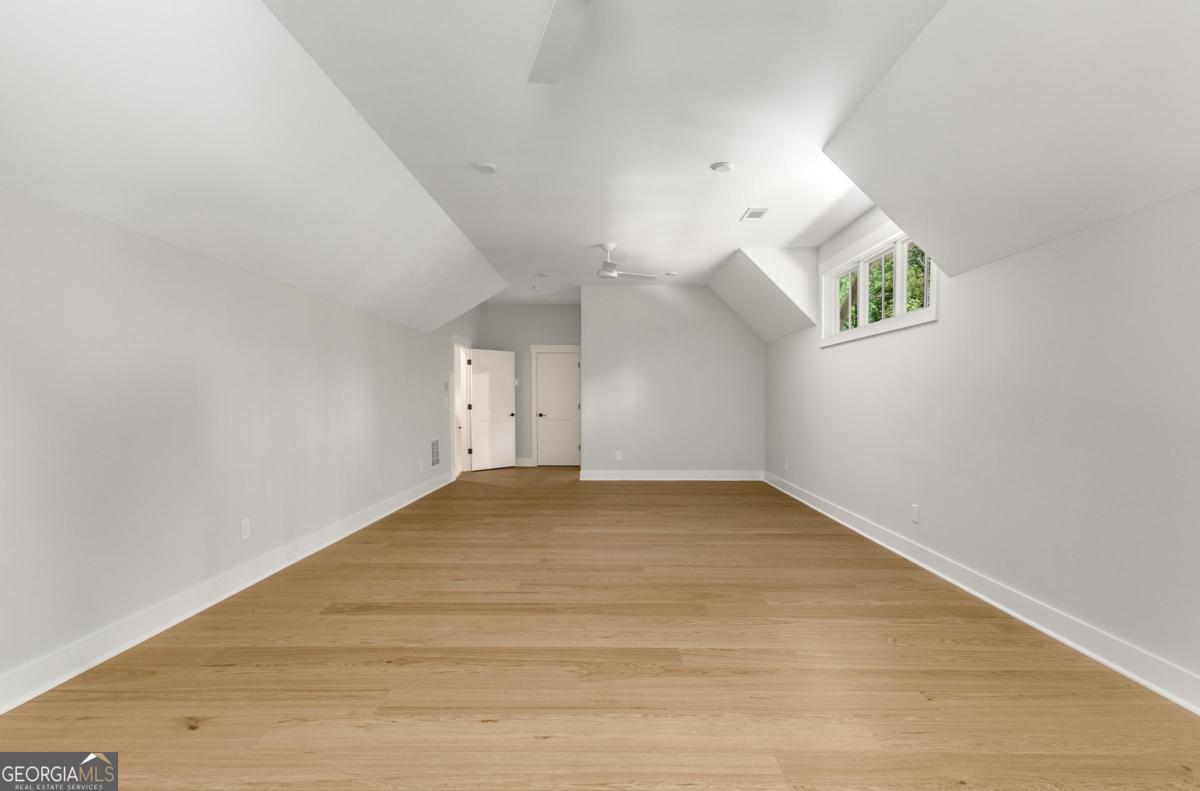 229 Eagles Way Eatonton, GA 31024 - Photo 33 of 61 a view of empty room with wooden floor