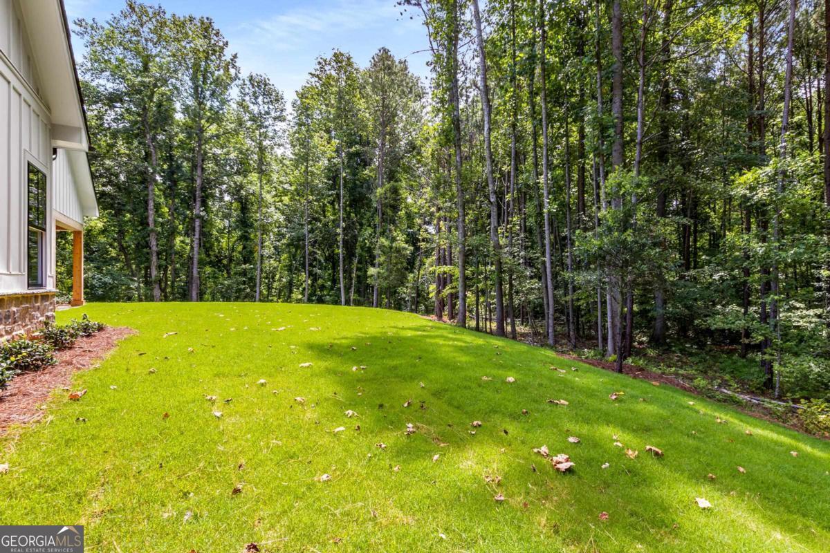 229 Eagles Way Eatonton, GA 31024 - Photo 38 of 61 a view of backyard with swimming pool