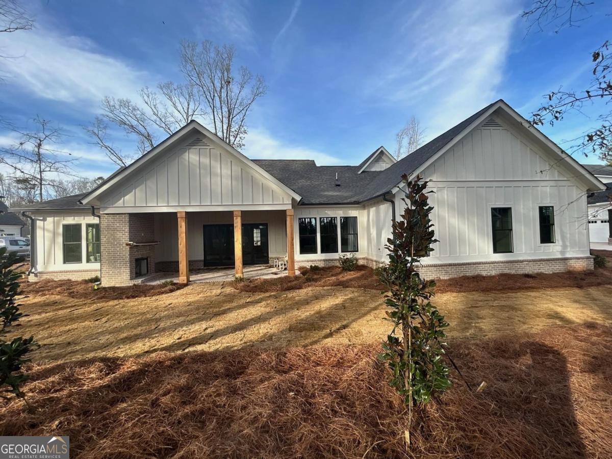 229 Eagles Way Eatonton, GA 31024 - Photo 4 of 61 a front view of a house with a yard