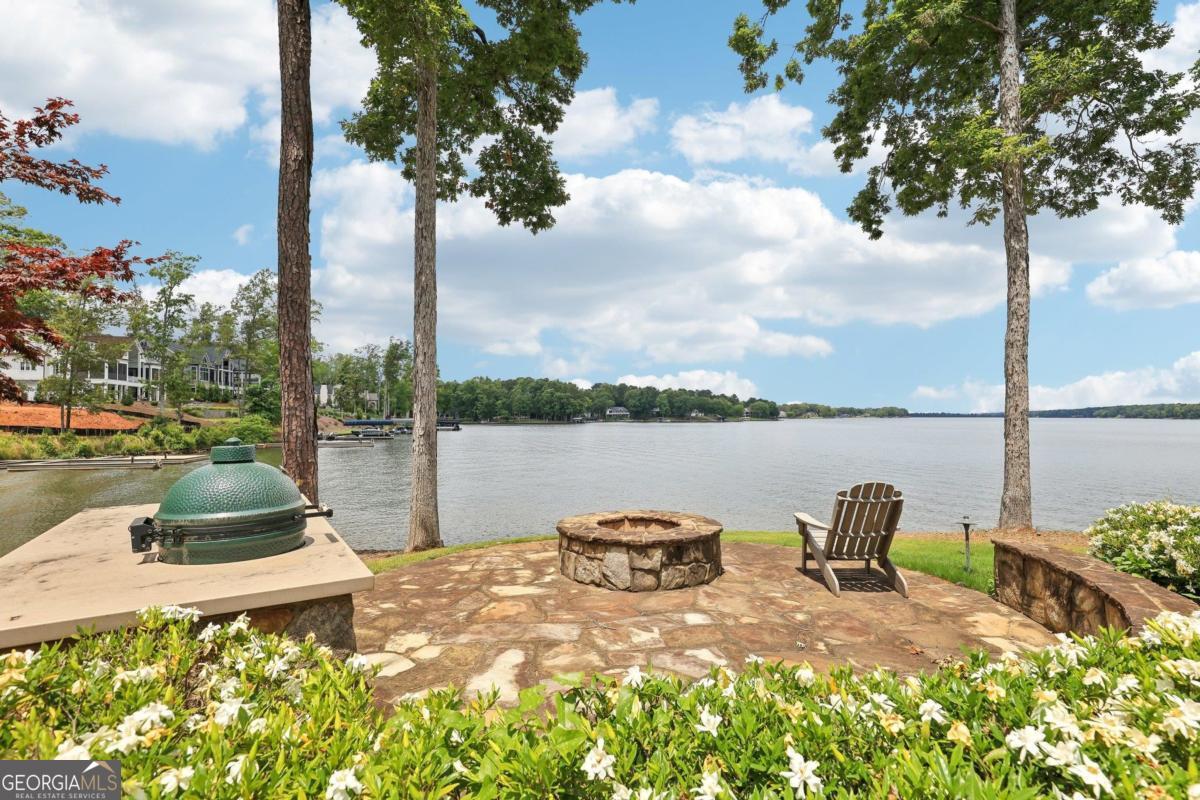 229 Eagles Way Eatonton, GA 31024 - Photo 59 of 61 a view of a lake with couches and chairs