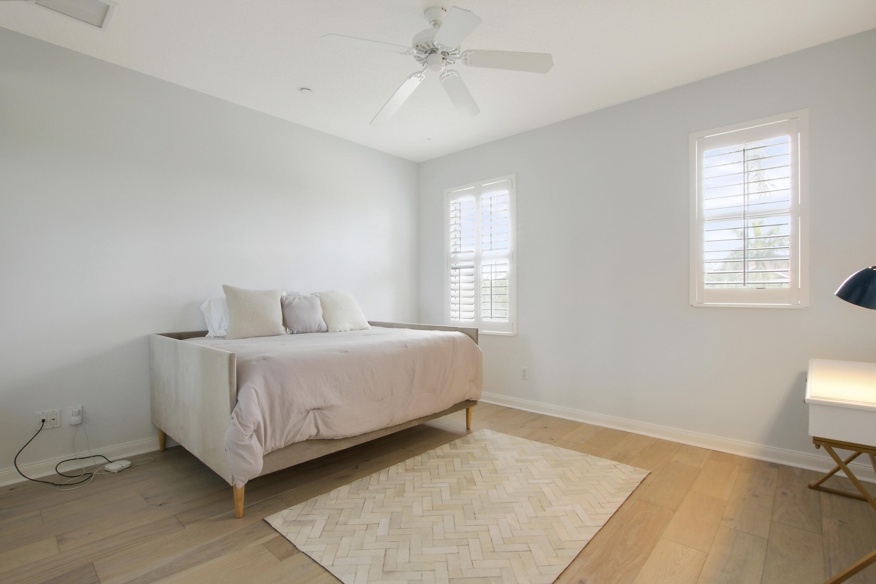 3424 West Community Drive Jupiter, FL 33458 - Photo 13 of 25 a spacious bedroom with a bed and a window