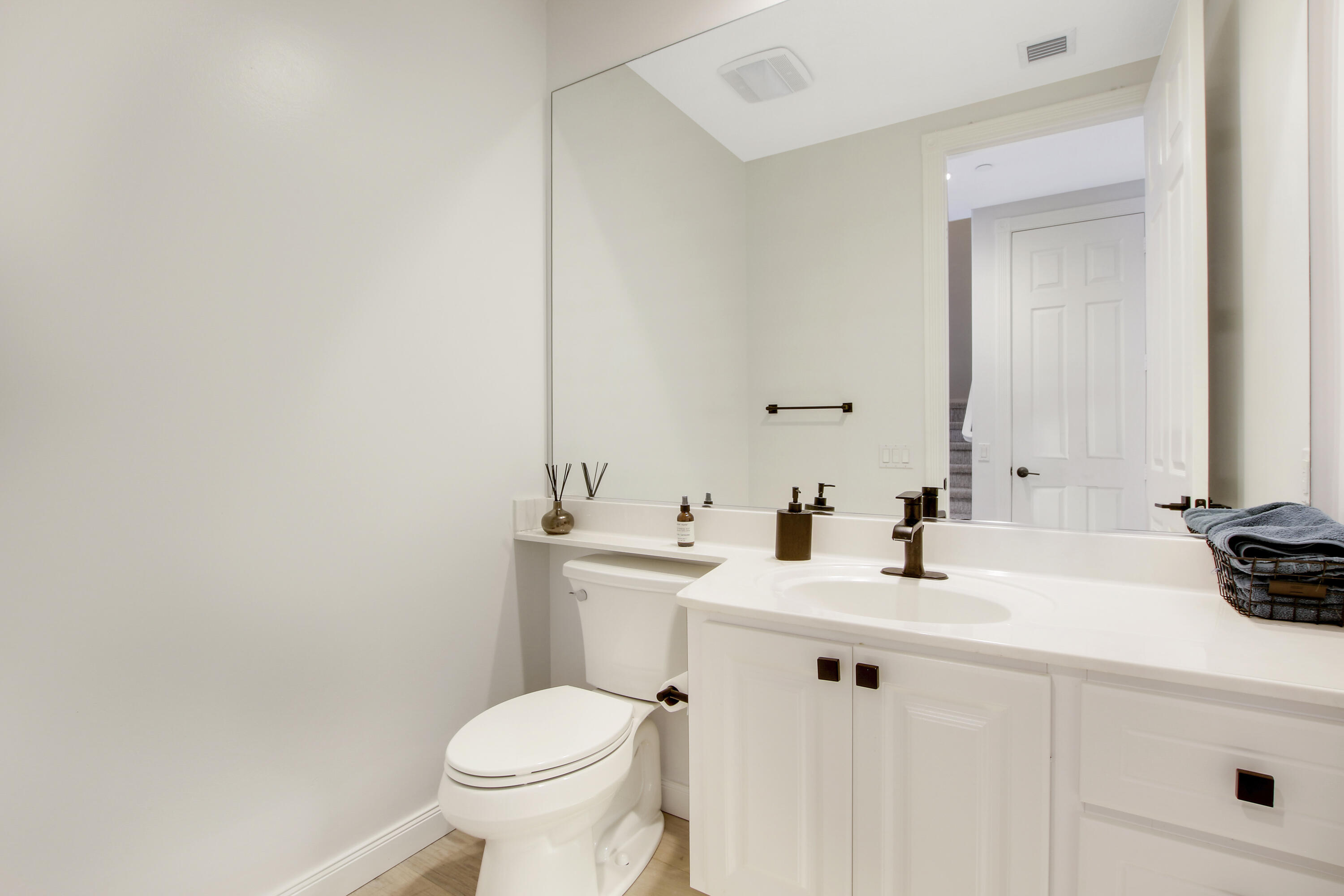 3424 West Community Drive Jupiter, FL 33458 - Photo 16 of 25 a bathroom with a sink toilet and a mirror