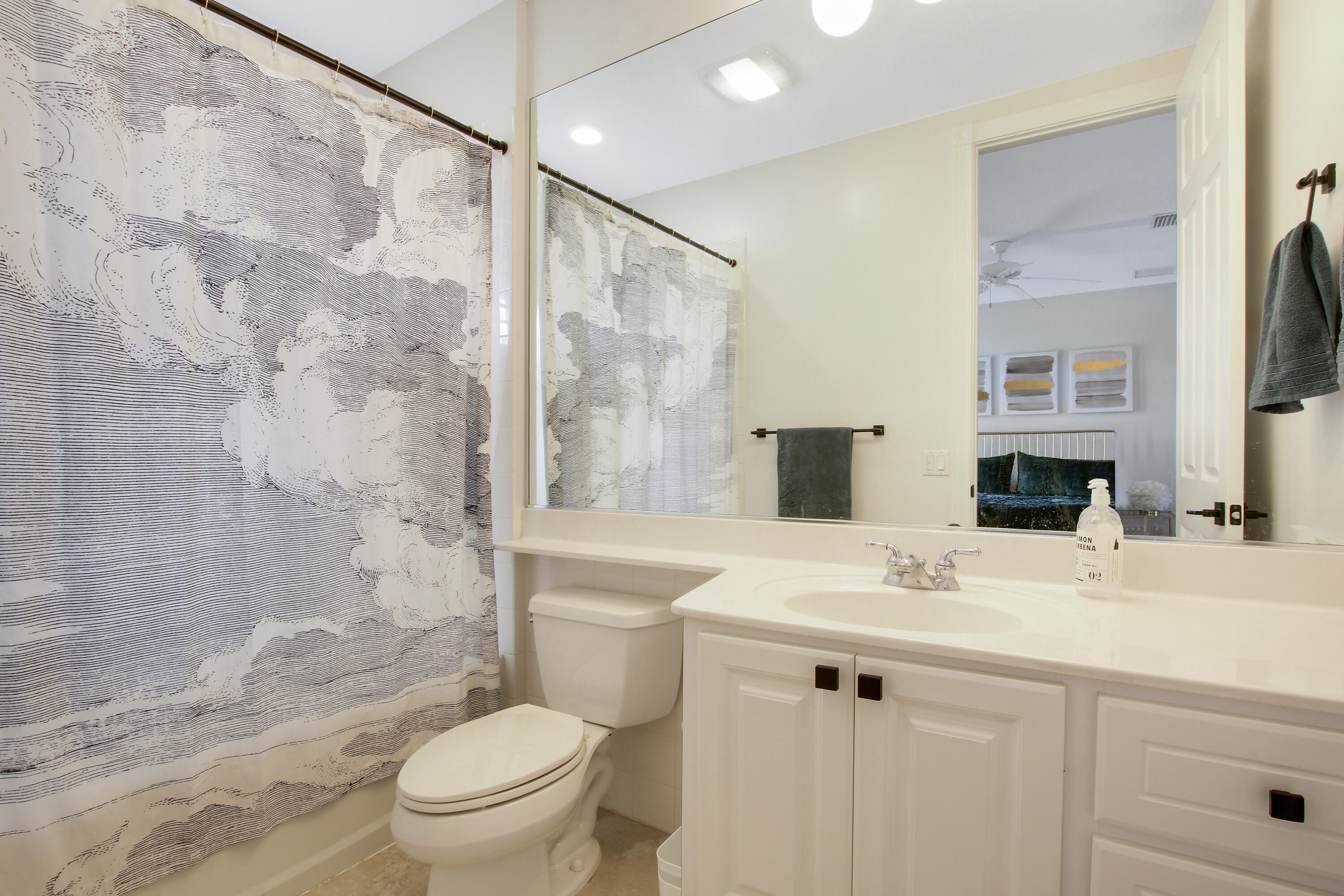 3424 West Community Drive Jupiter, FL 33458 - Photo 17 of 25 a bathroom with a sink toilet tub and shower