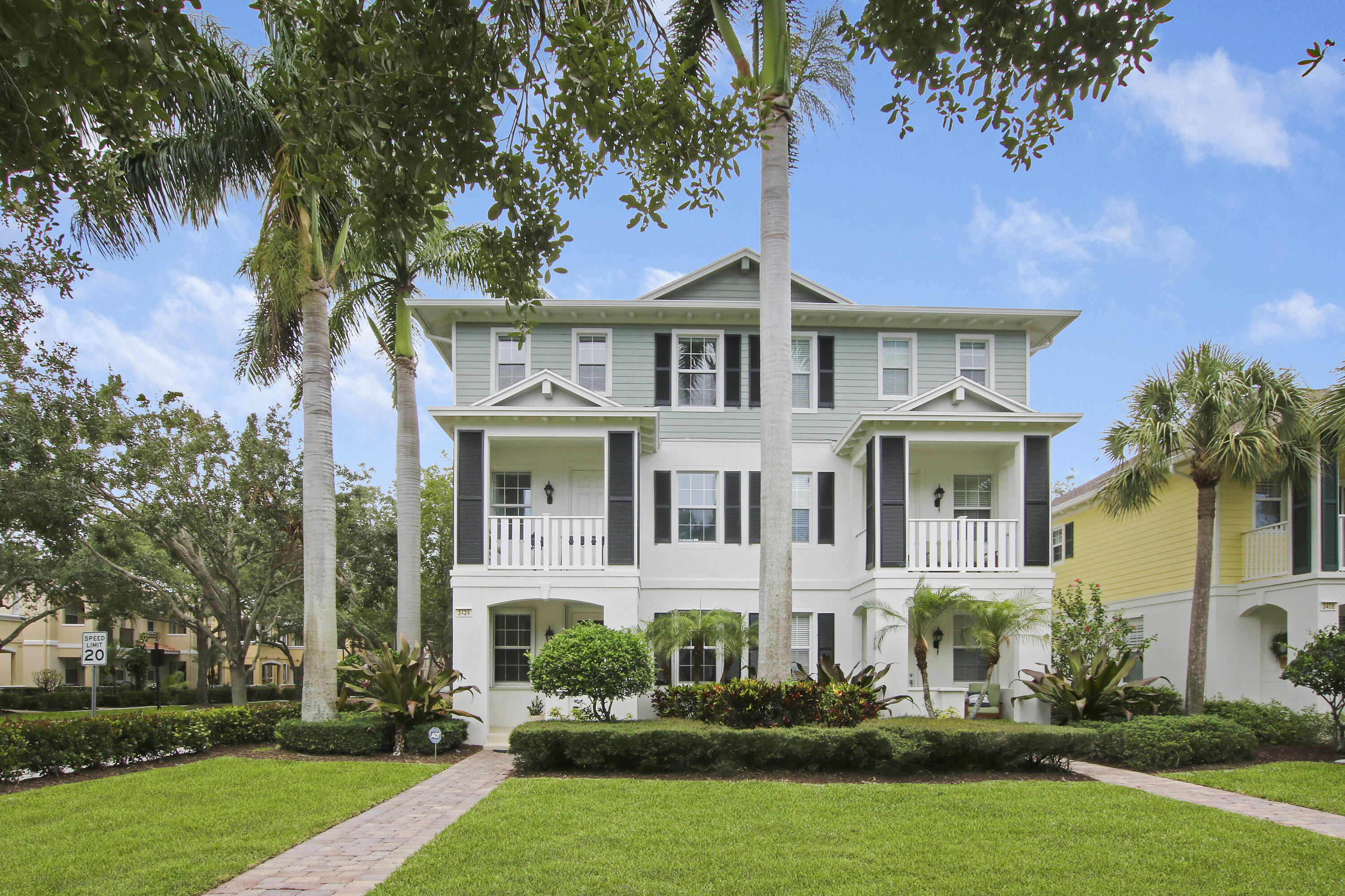 3424 West Community Drive Jupiter, FL 33458 - Photo 22 of 25 front view of a house with a yard