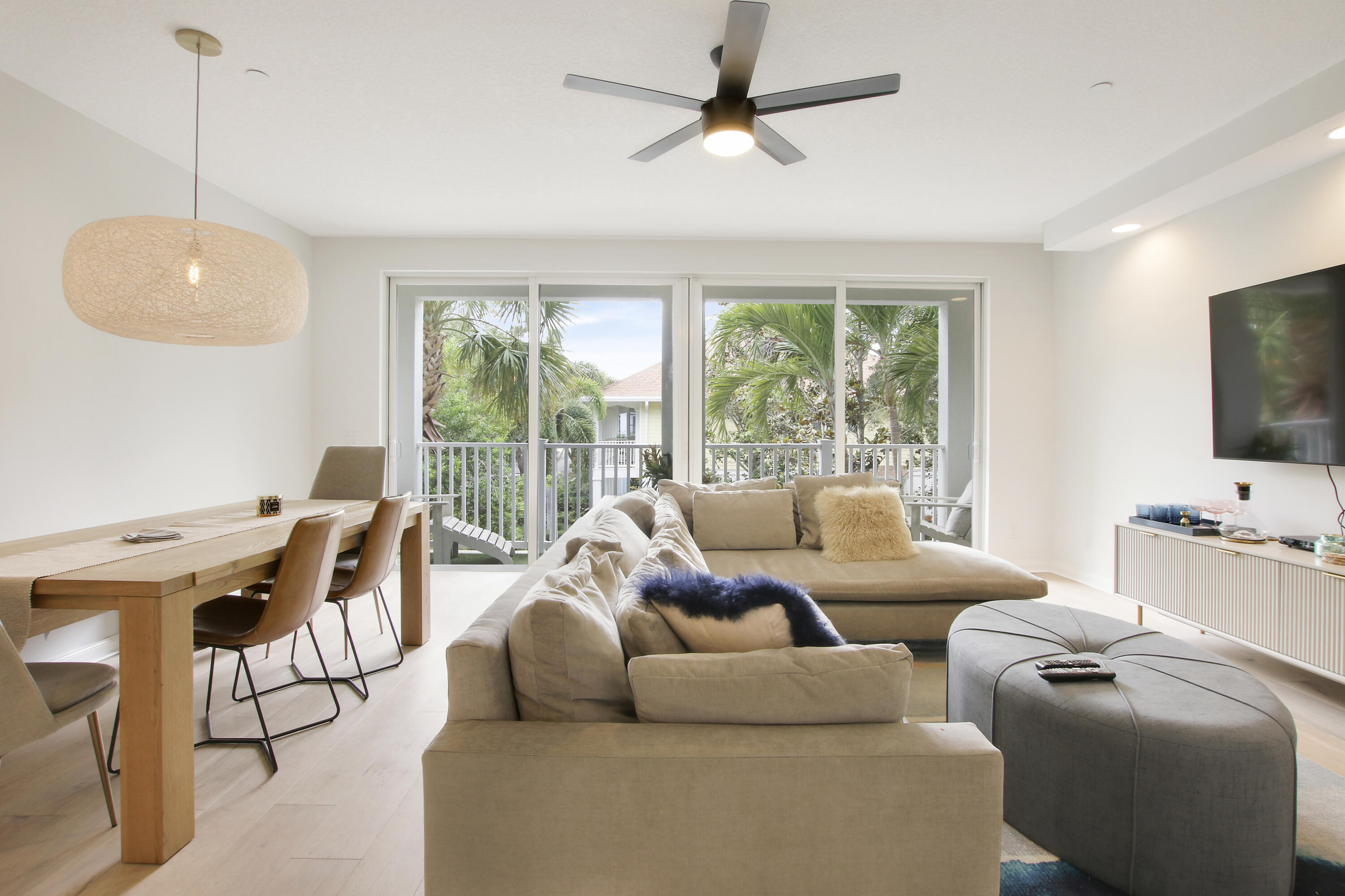 3424 West Community Drive Jupiter, FL 33458 - Photo 5 of 25 a living room with furniture and a flat screen tv