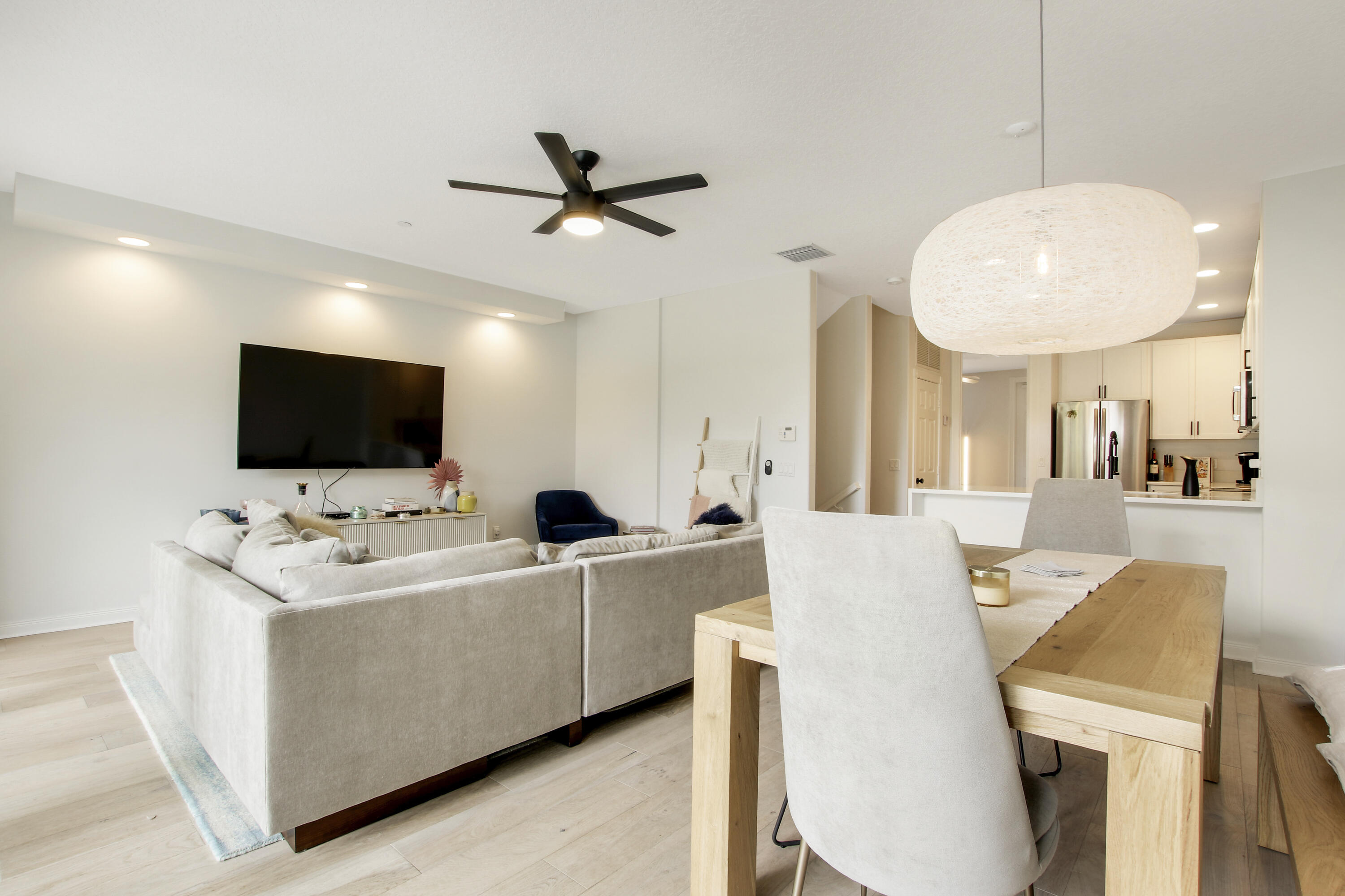 3424 West Community Drive Jupiter, FL 33458 - Photo 6 of 25 a living room with furniture and a flat screen tv