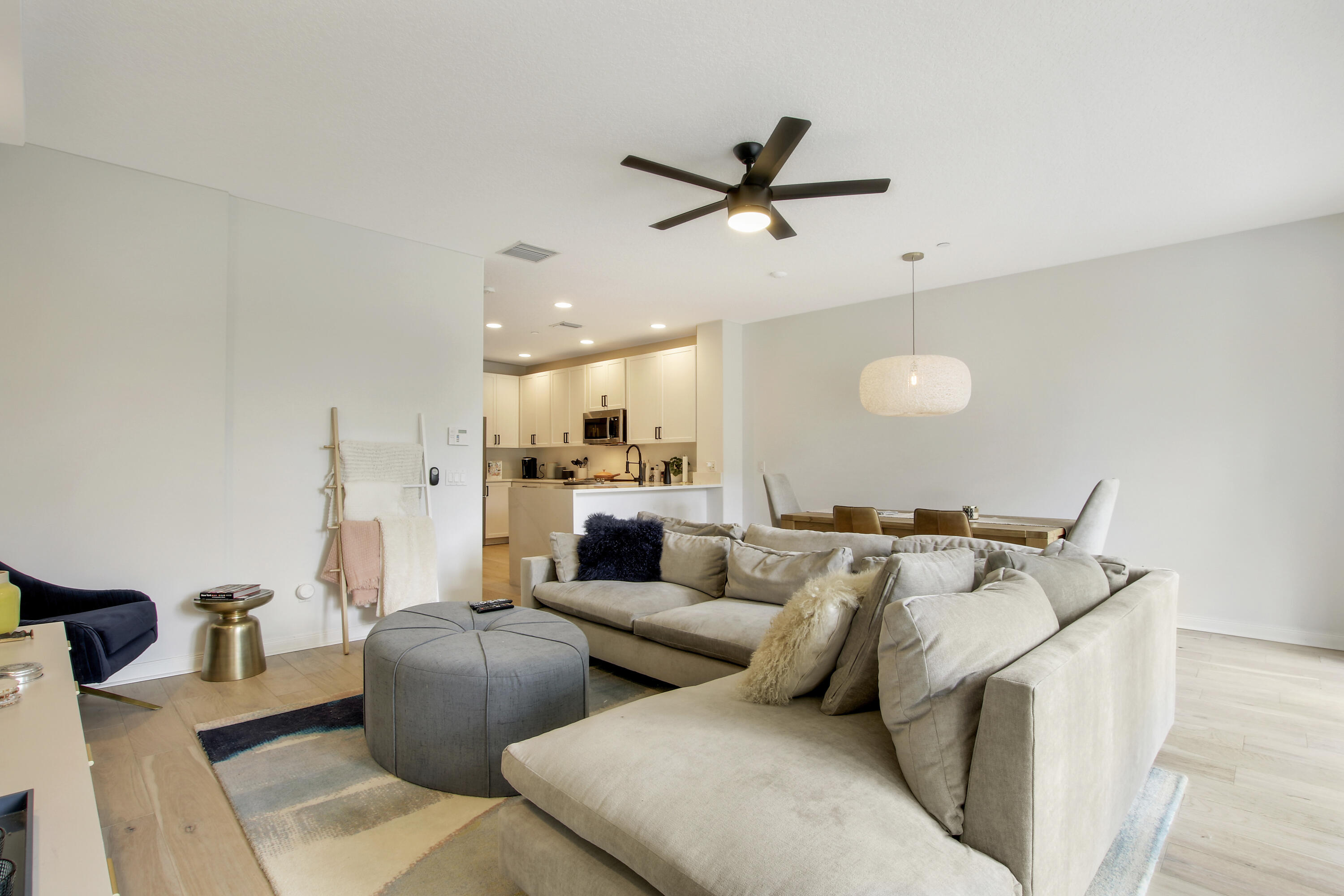3424 West Community Drive Jupiter, FL 33458 - Photo 8 of 25 a living room with furniture and a ceiling fan