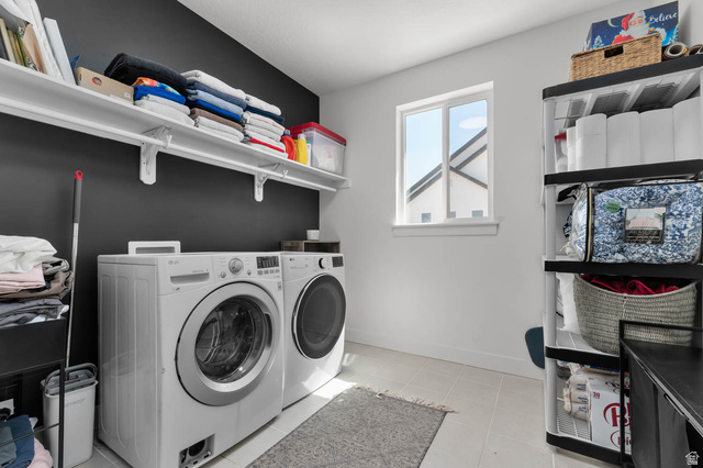 500 North 516th Street West, Unit 19 Mapleton, UT 84664 - Photo 19 of 41 Dedicated laundry room conviently located on the first floor. Featuring light-toned tile flooring and a contrasting accent wall.